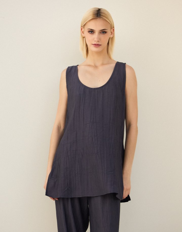 Sleeveless top with openings