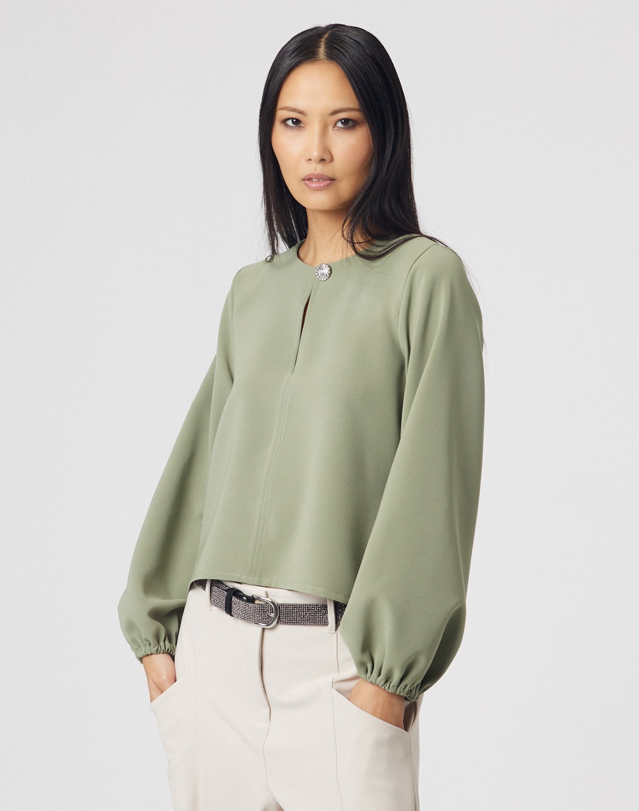 Asymmetric blouse with jewel button