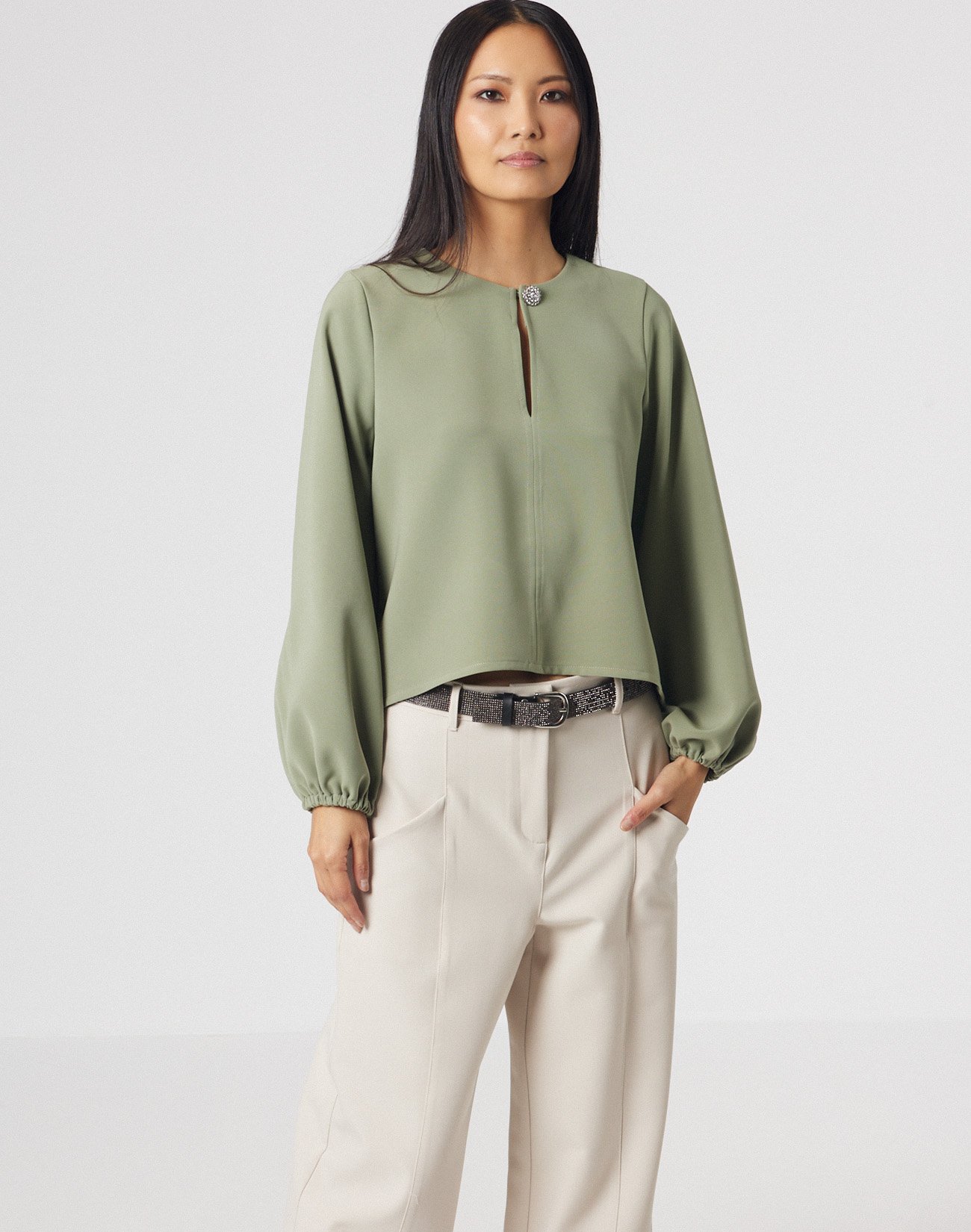 Asymmetric blouse with jewel button