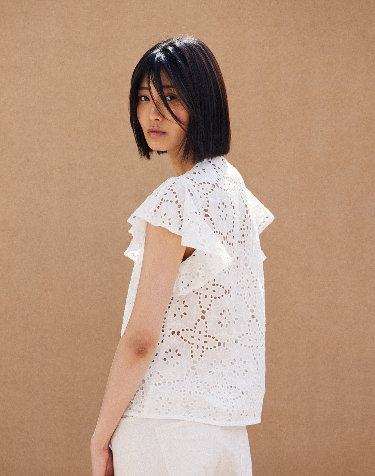 Top with cutwork embroidery