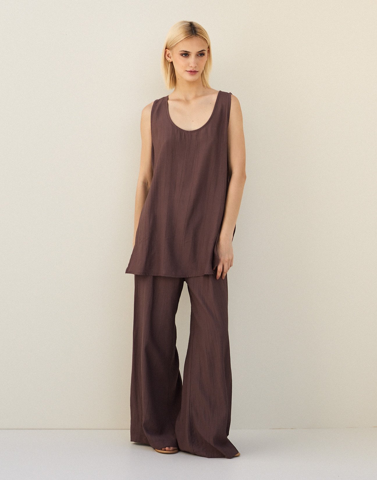 Sleeveless top with openings