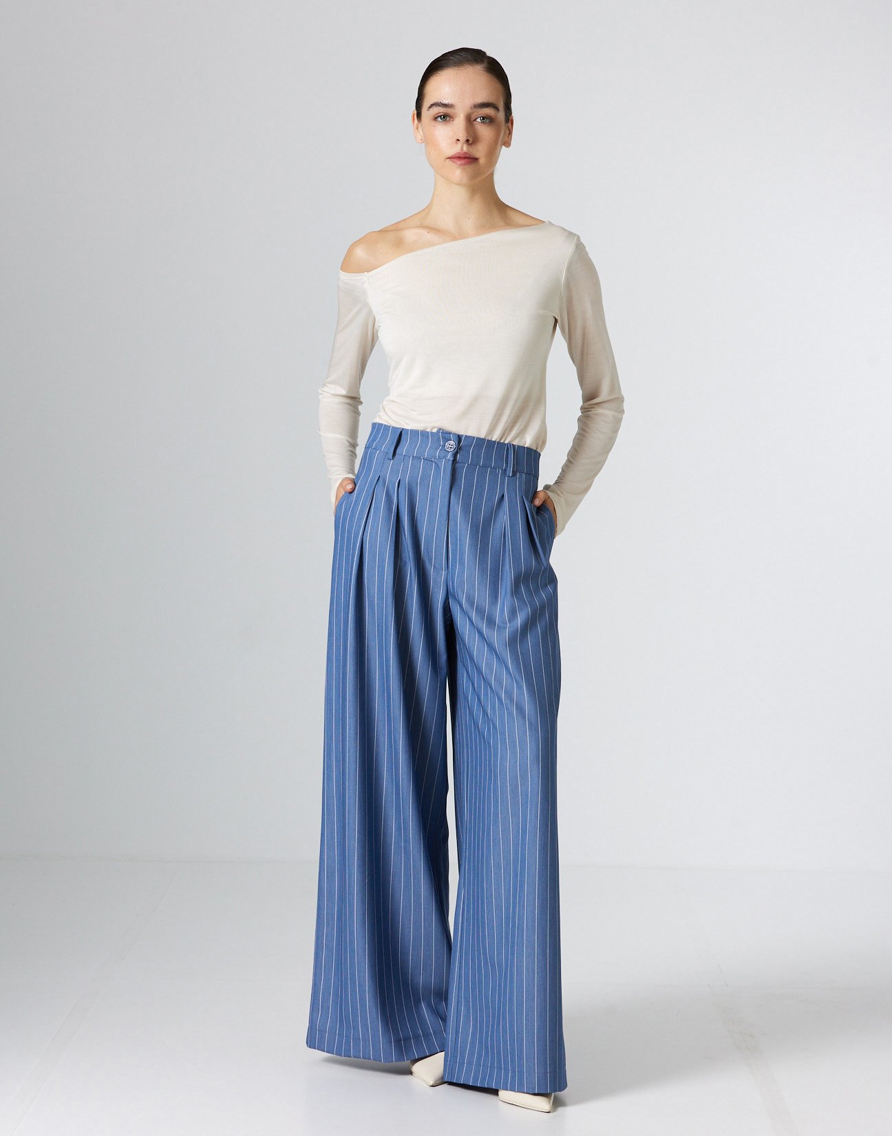 Pinstripe trousers with pleats