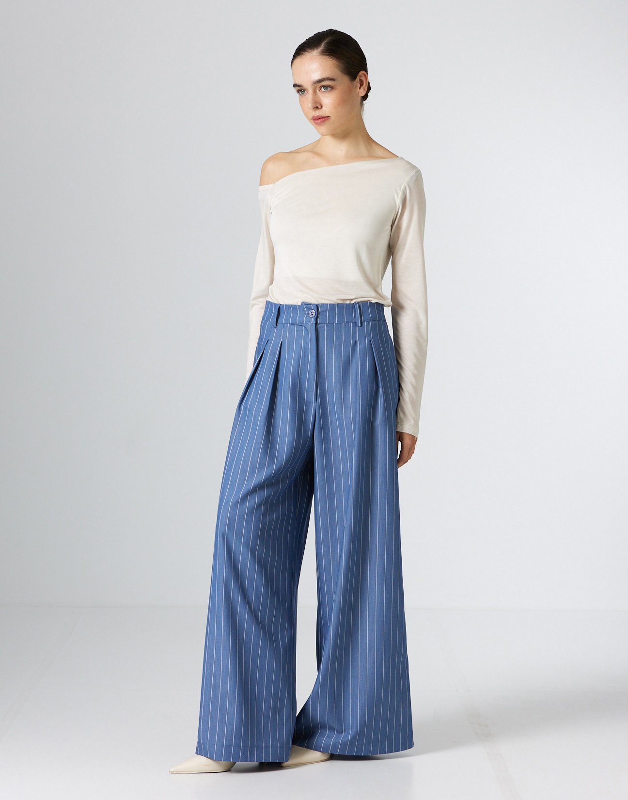 Pinstripe trousers with pleats