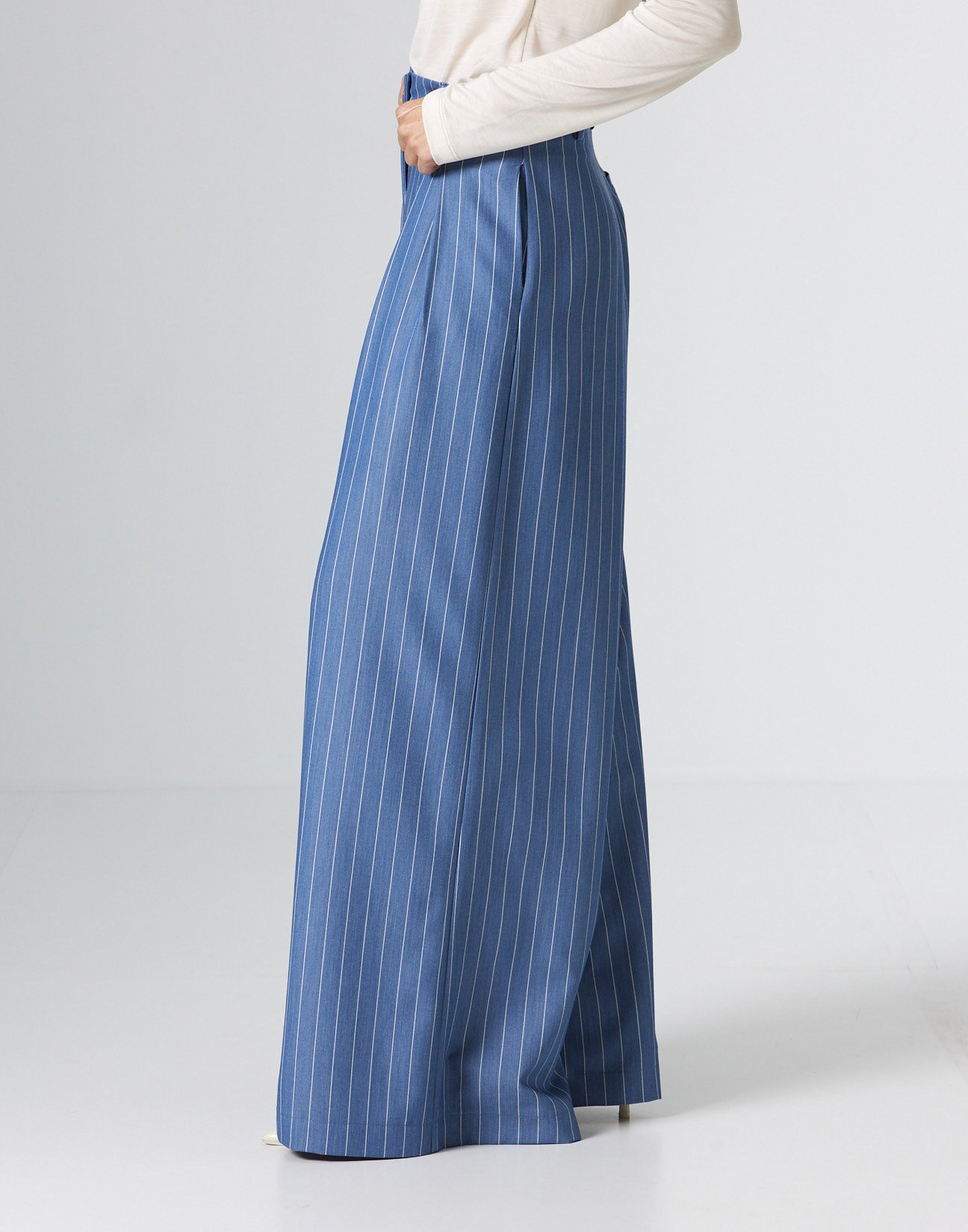 Pinstripe trousers with pleats