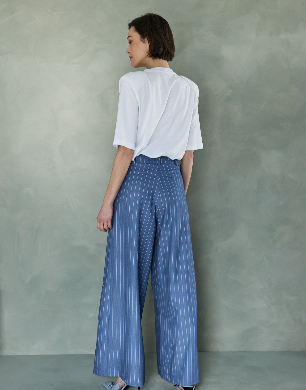 Pinstripe trousers with pleats