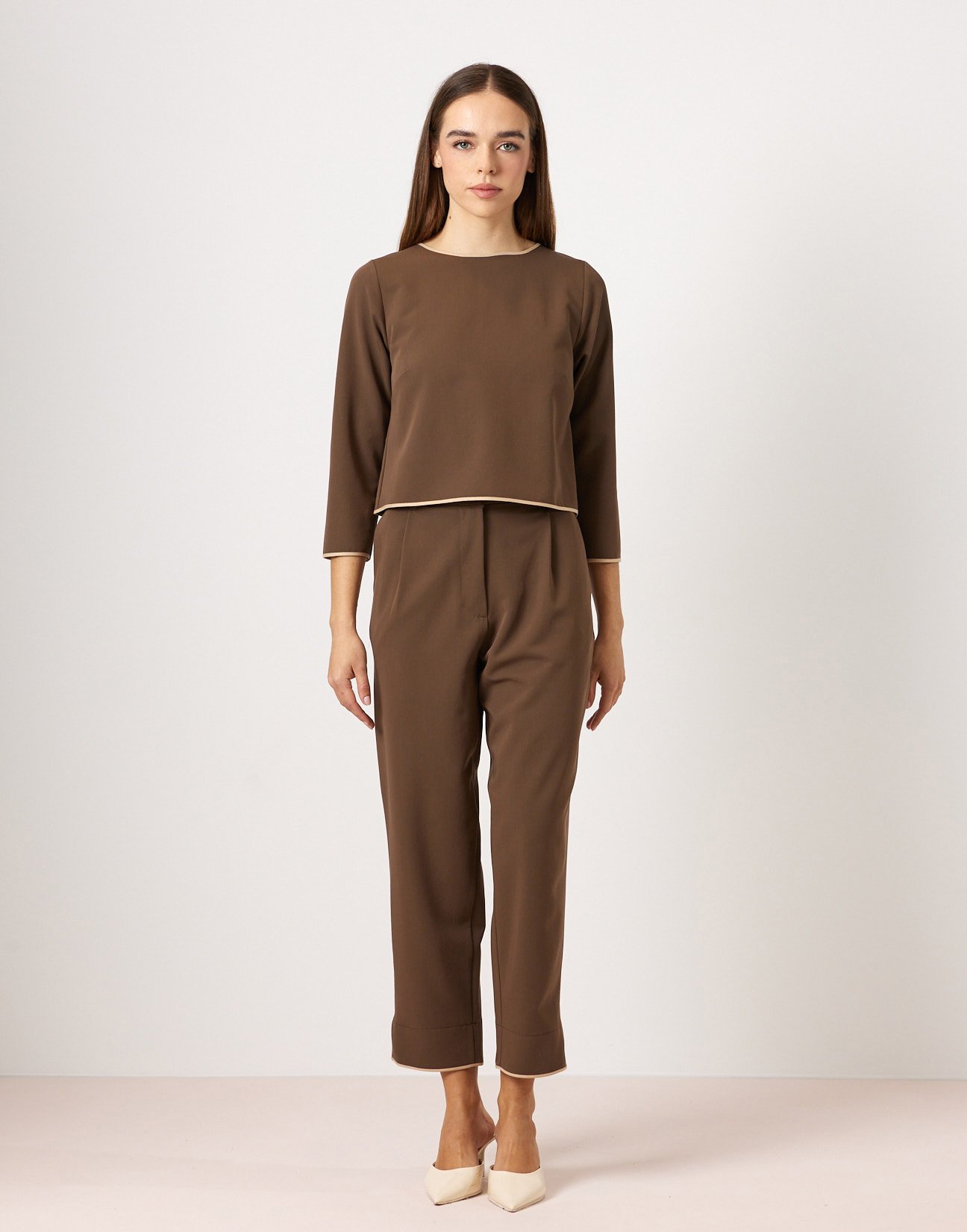 Trousers with piped seams
