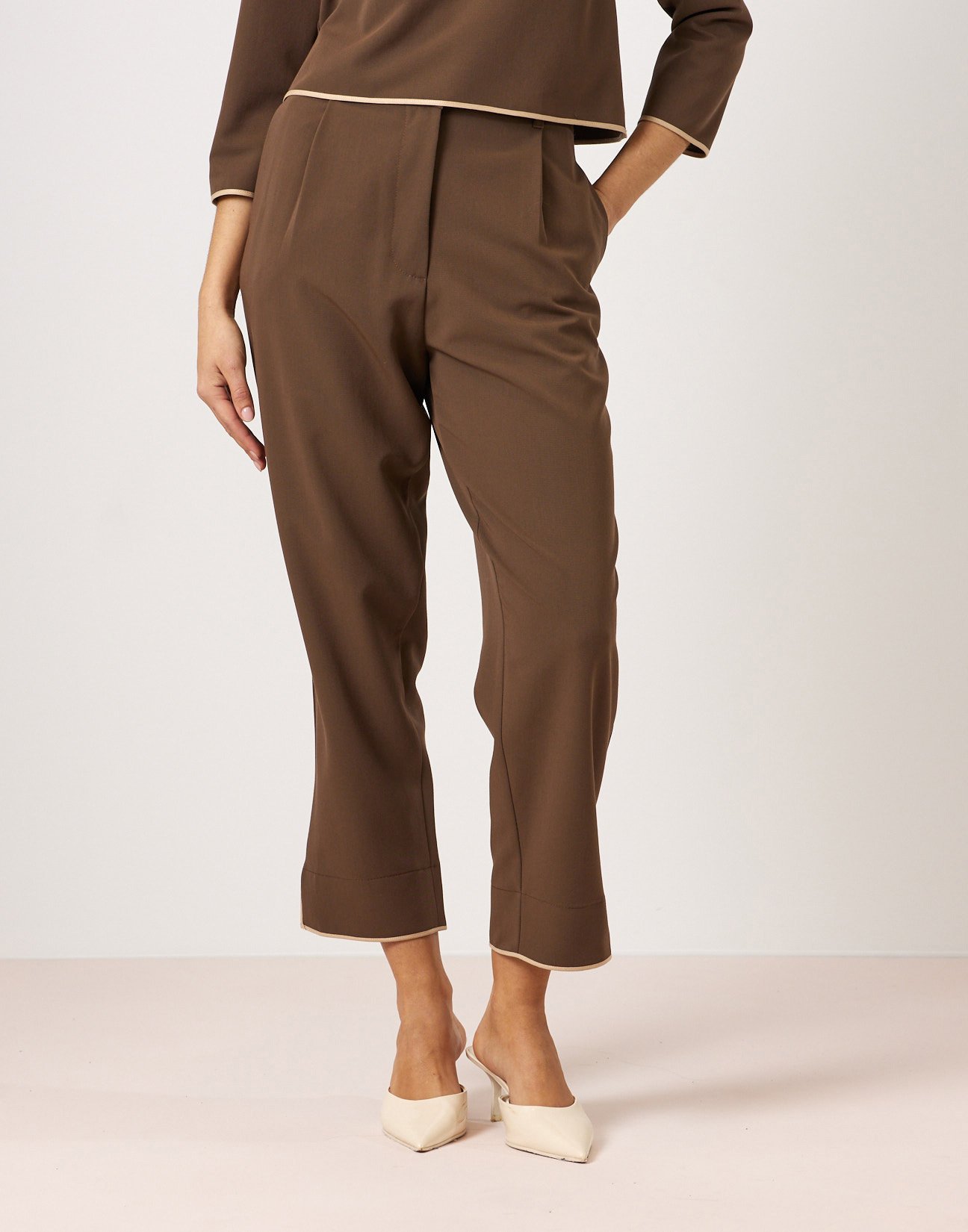 Trousers with piped seams