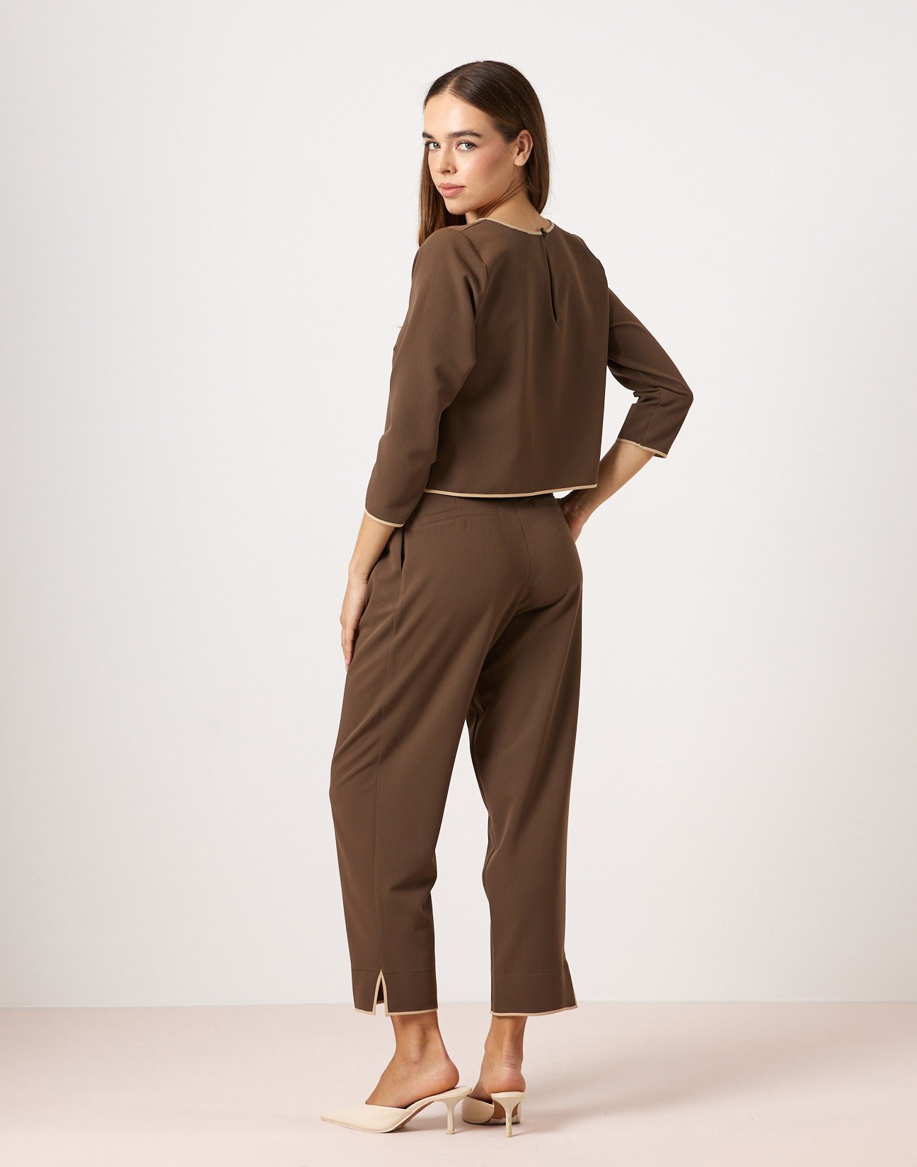 Trousers with piped seams