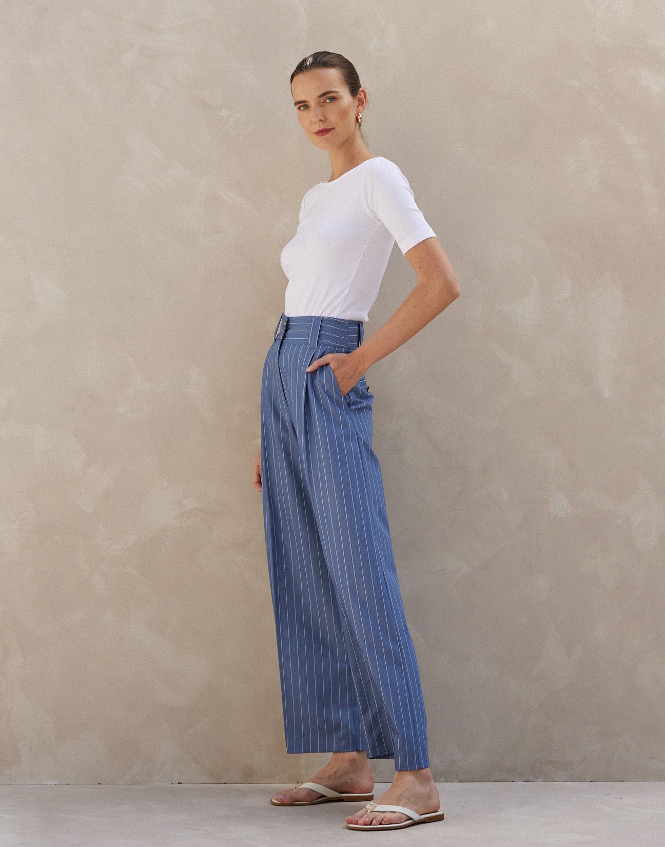 Pinstripe trousers with buttons