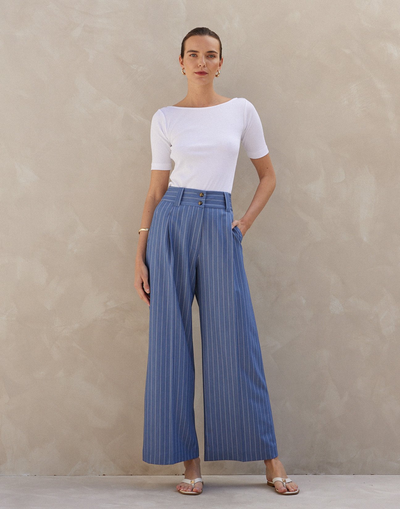 Pinstripe trousers with buttons