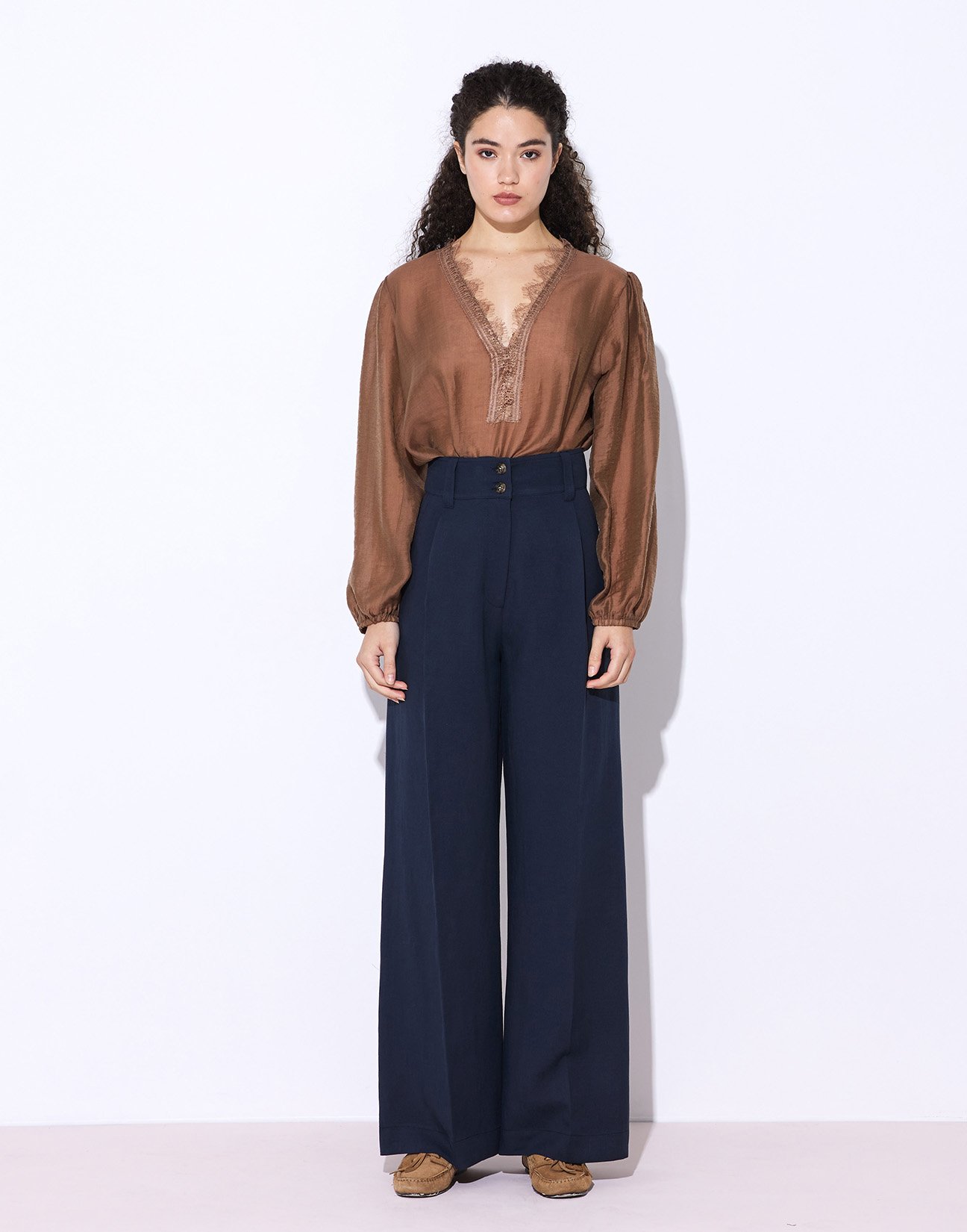 Trousers with buttons