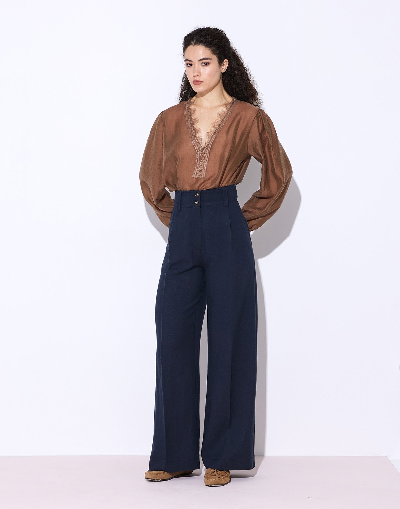 Trousers with buttons