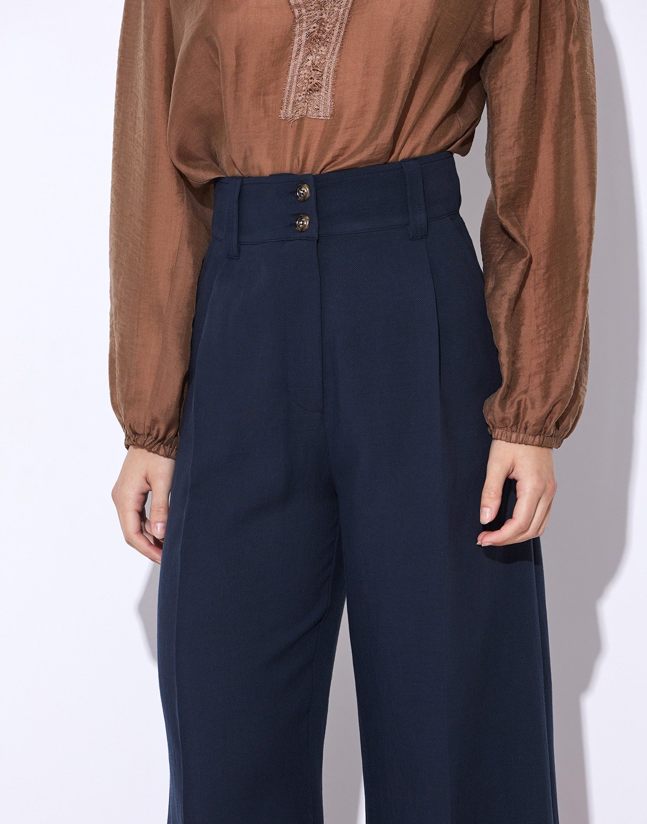 Trousers with buttons
