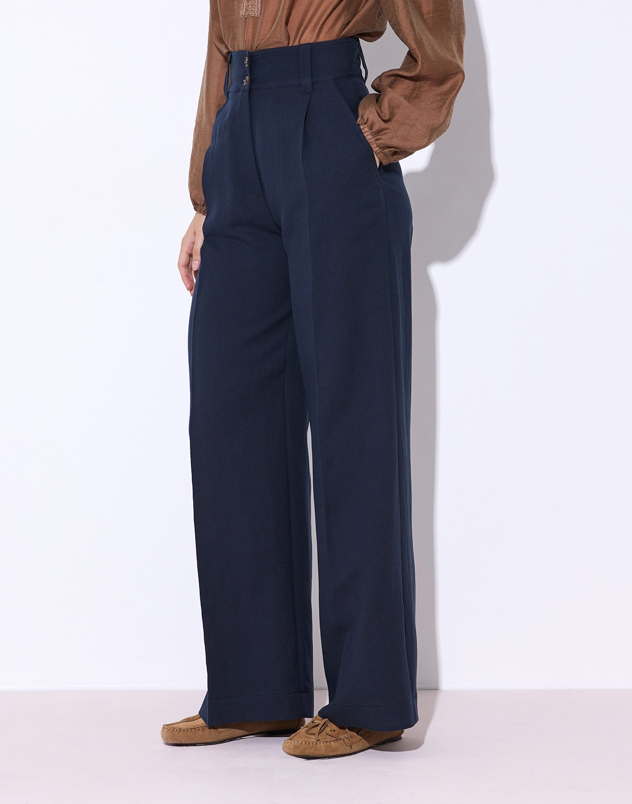 Trousers with buttons