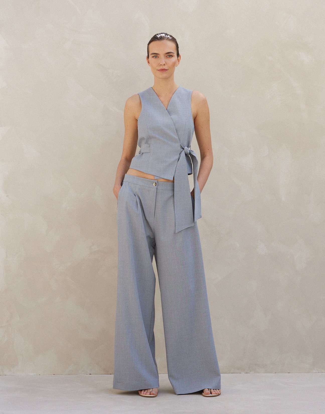 Pinstripe trousers with pleats