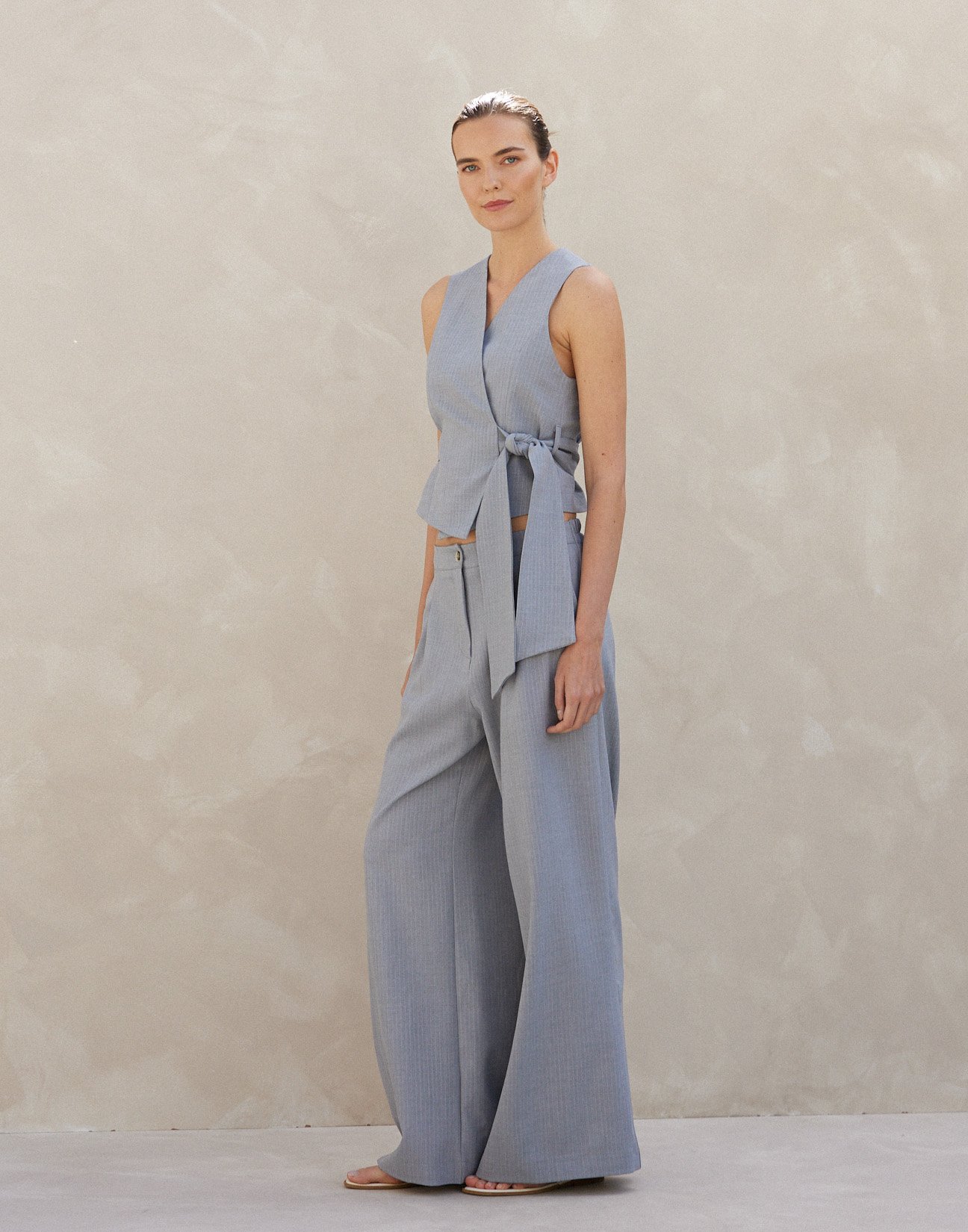 Pinstripe trousers with pleats