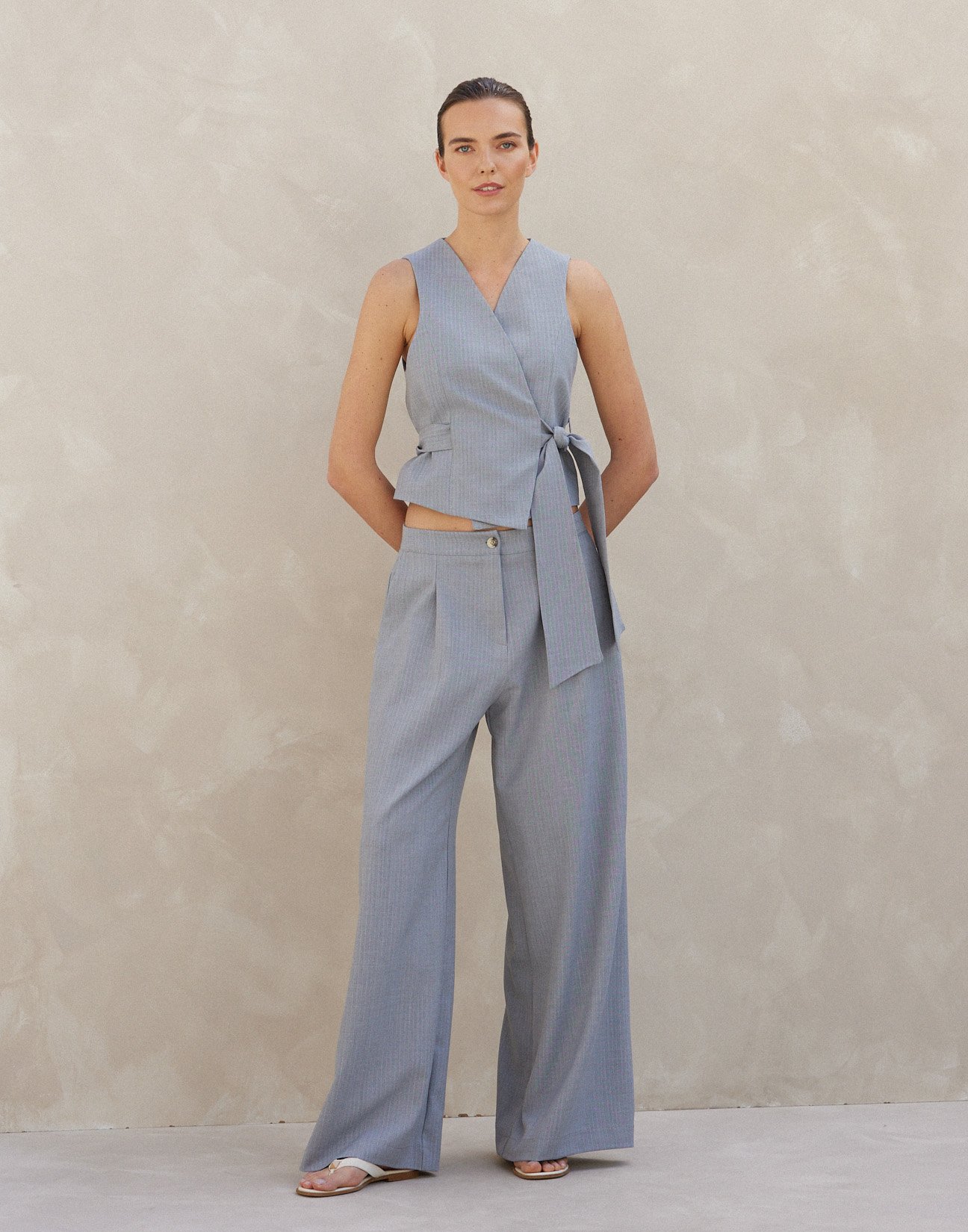 Pinstripe trousers with pleats