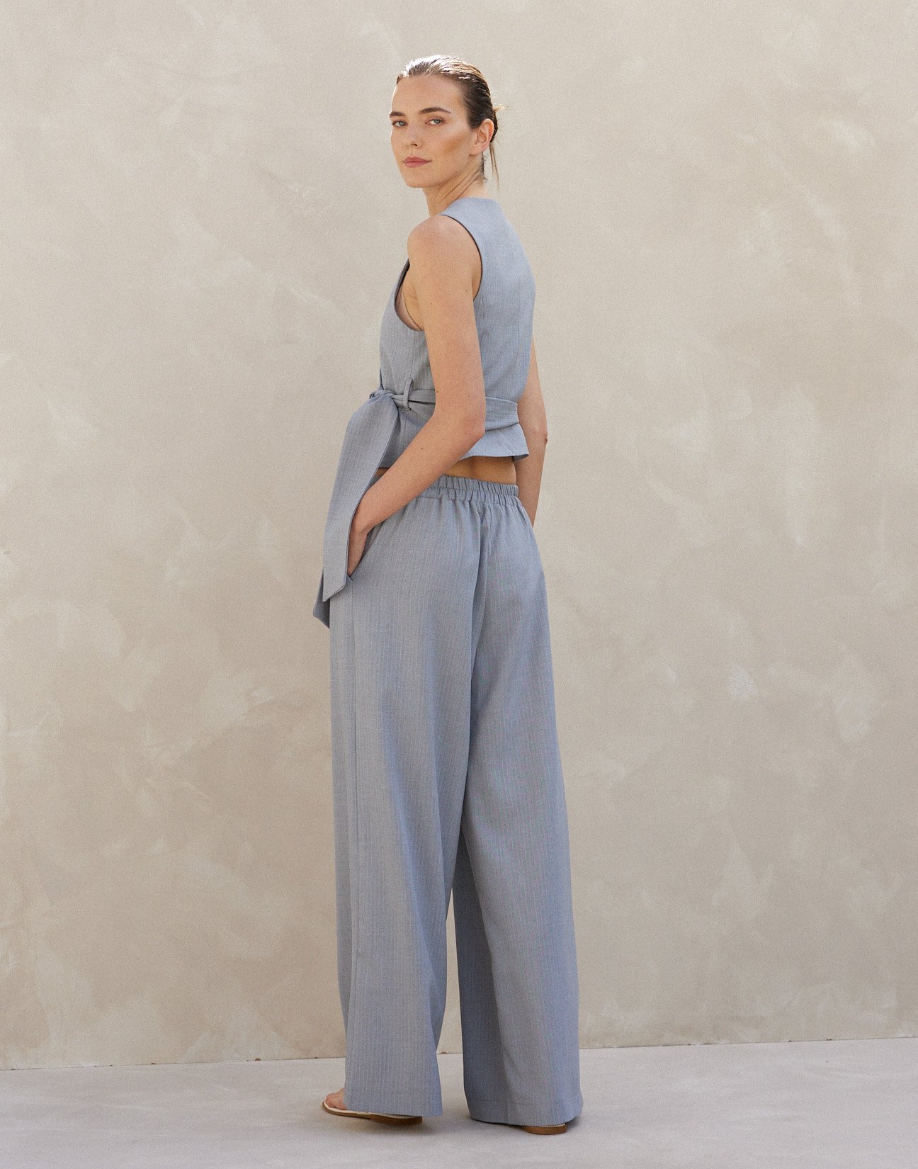 Pinstripe trousers with pleats