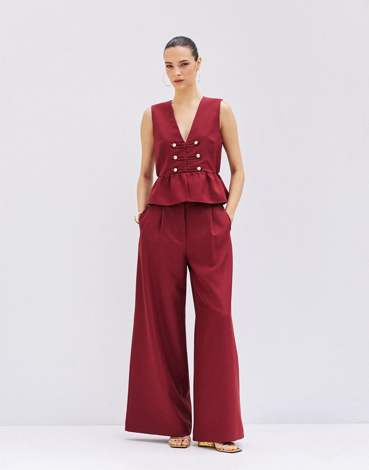 Trousers with buttons