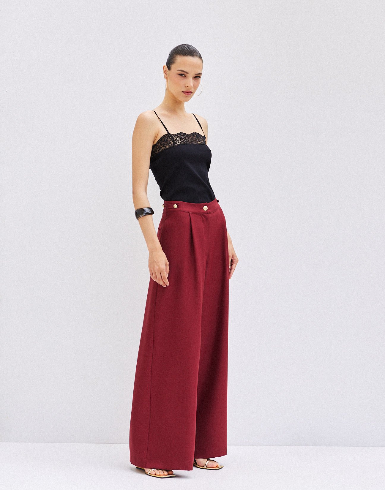 Trousers with buttons