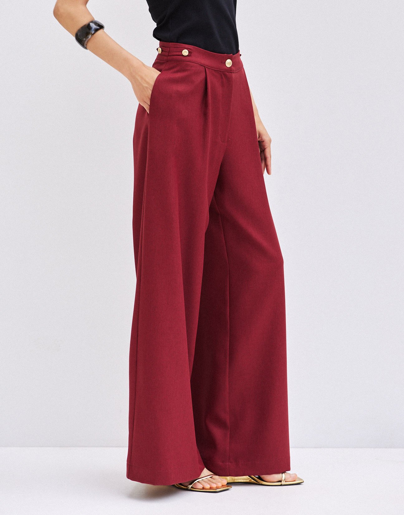 Trousers with buttons