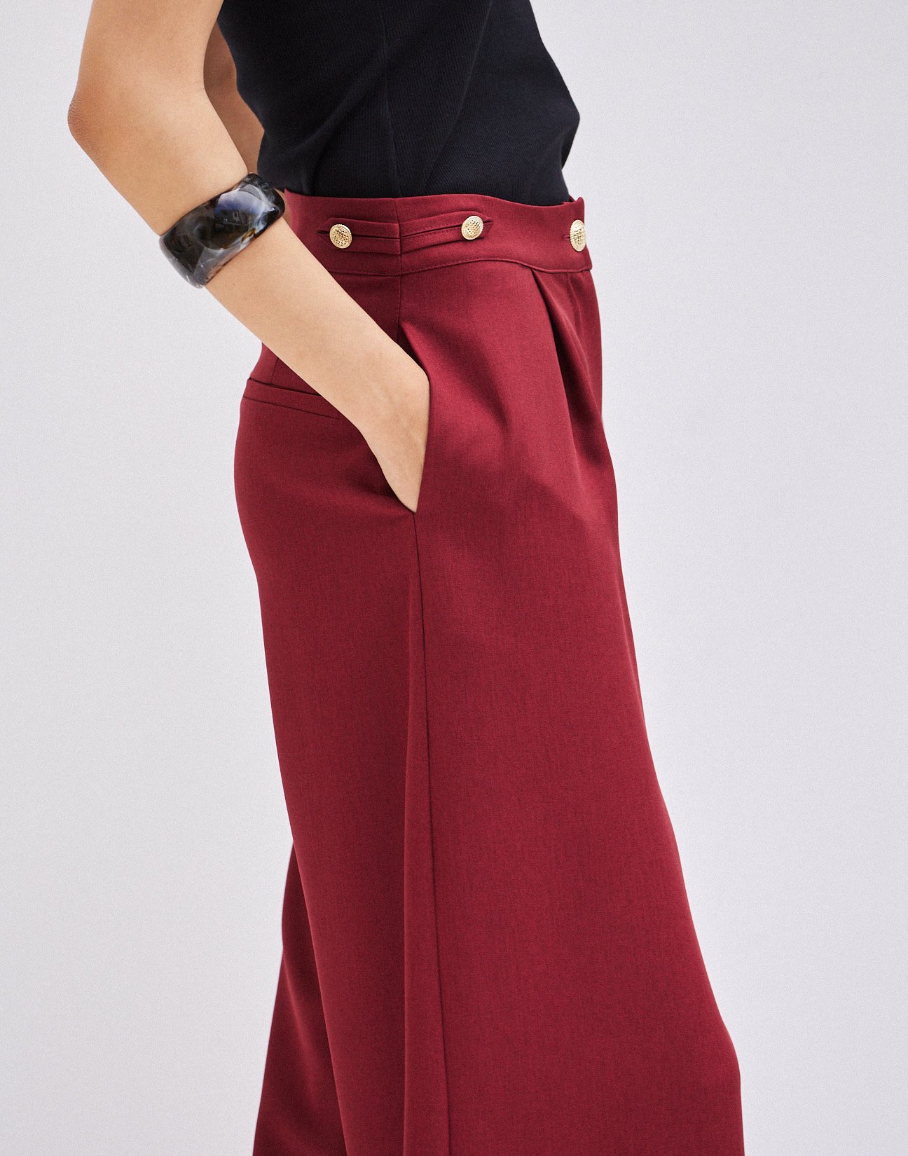 Trousers with buttons