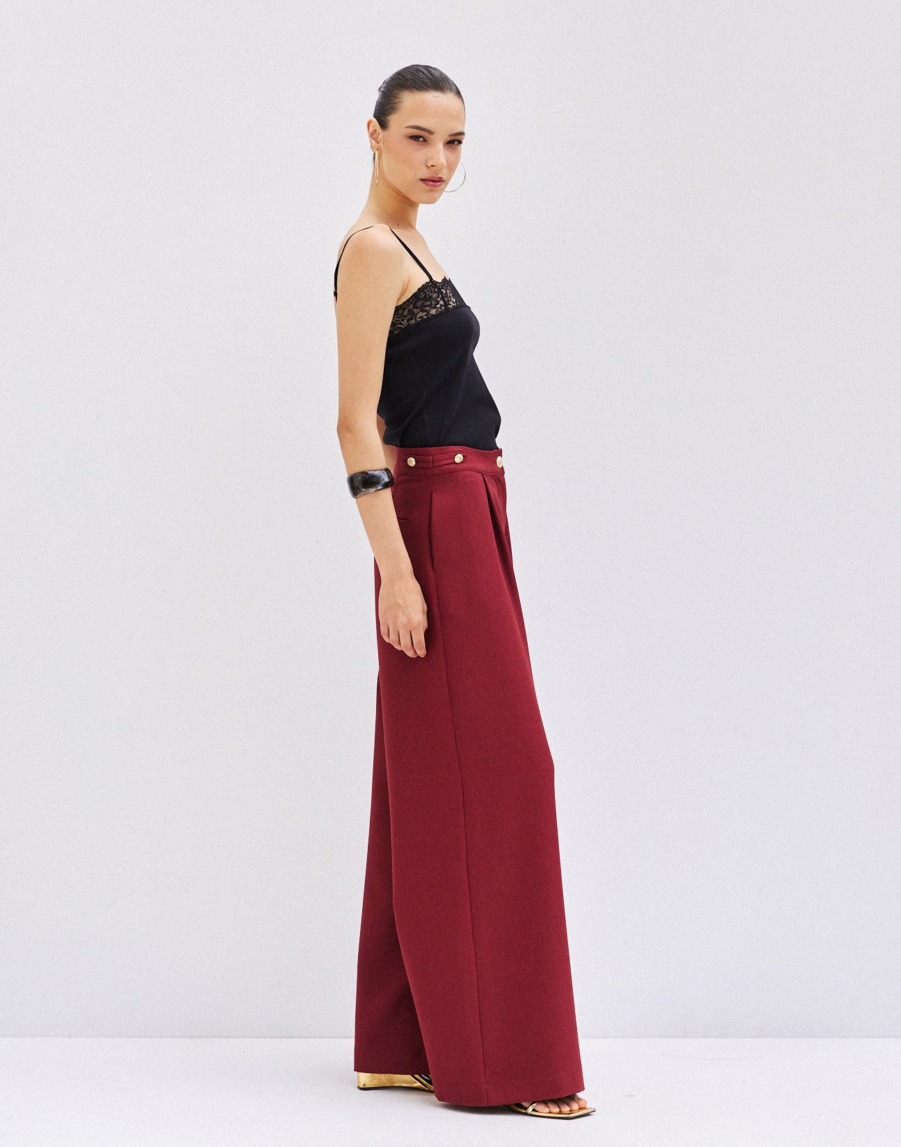 Trousers with buttons