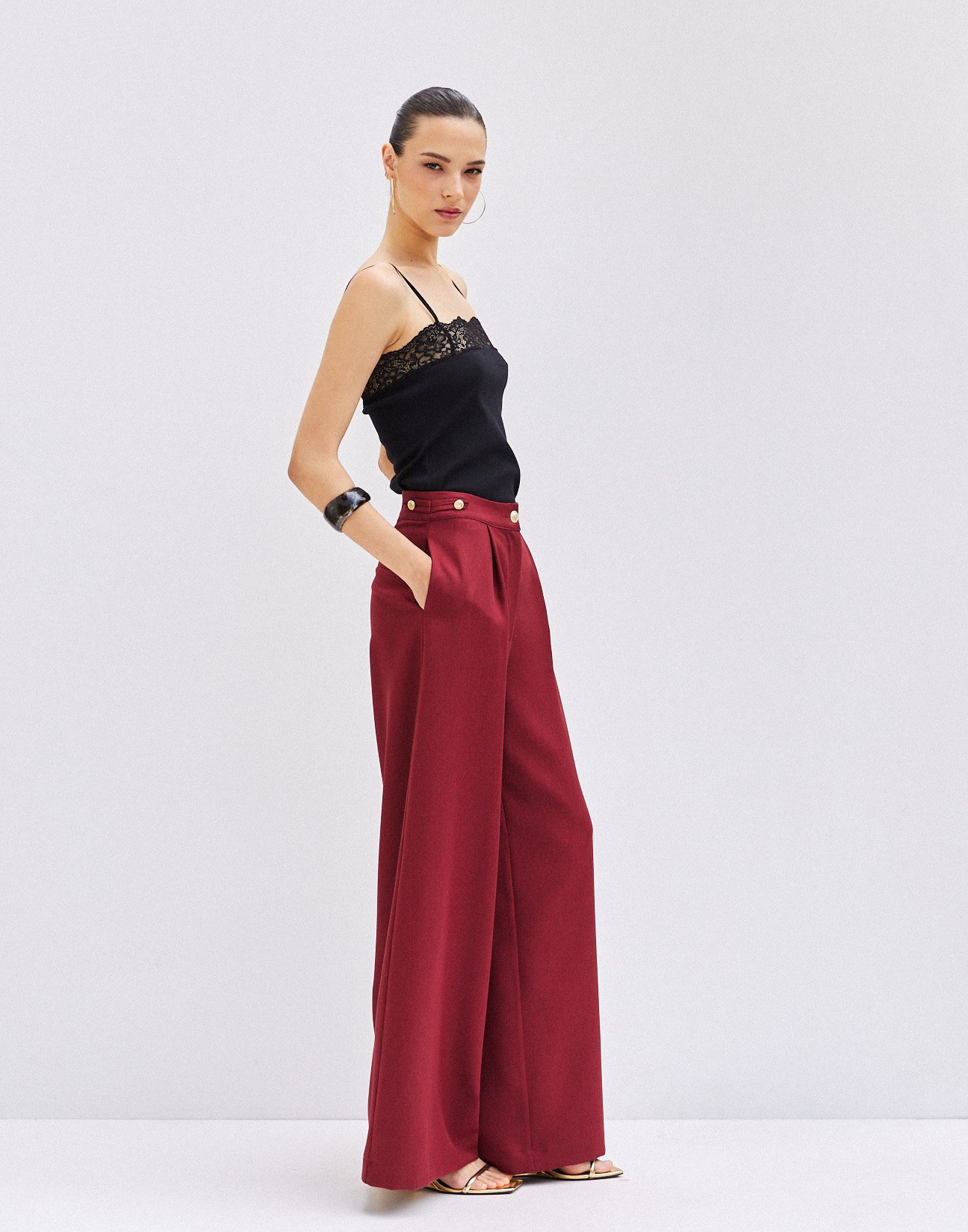 Trousers with buttons