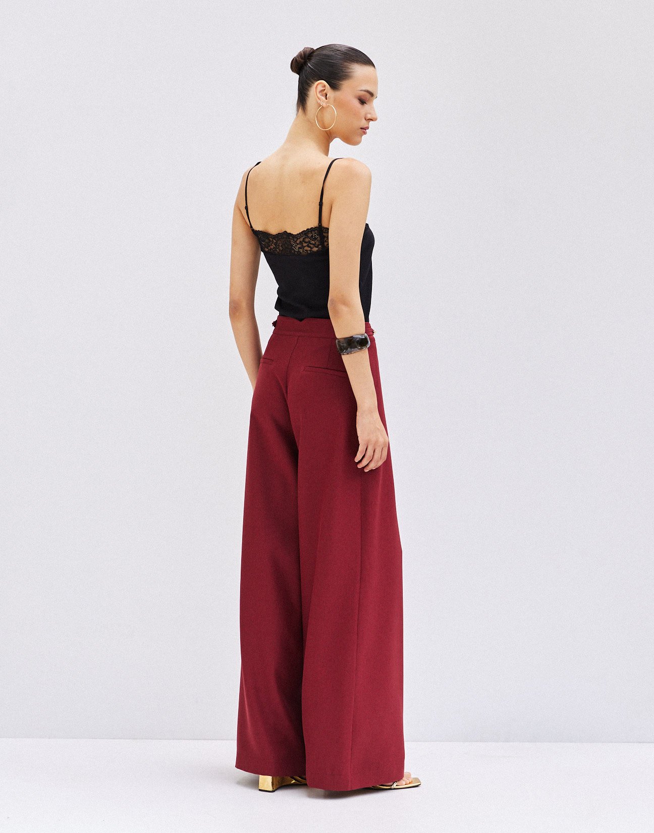 Trousers with buttons