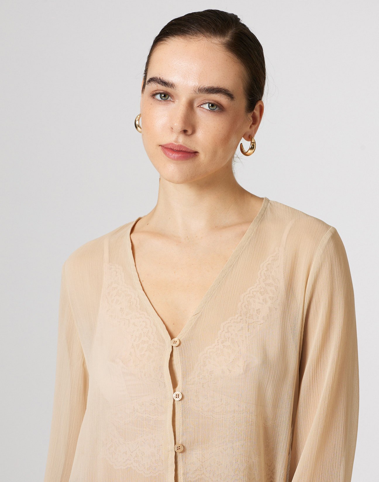 Semi sheer shirt with ruffles