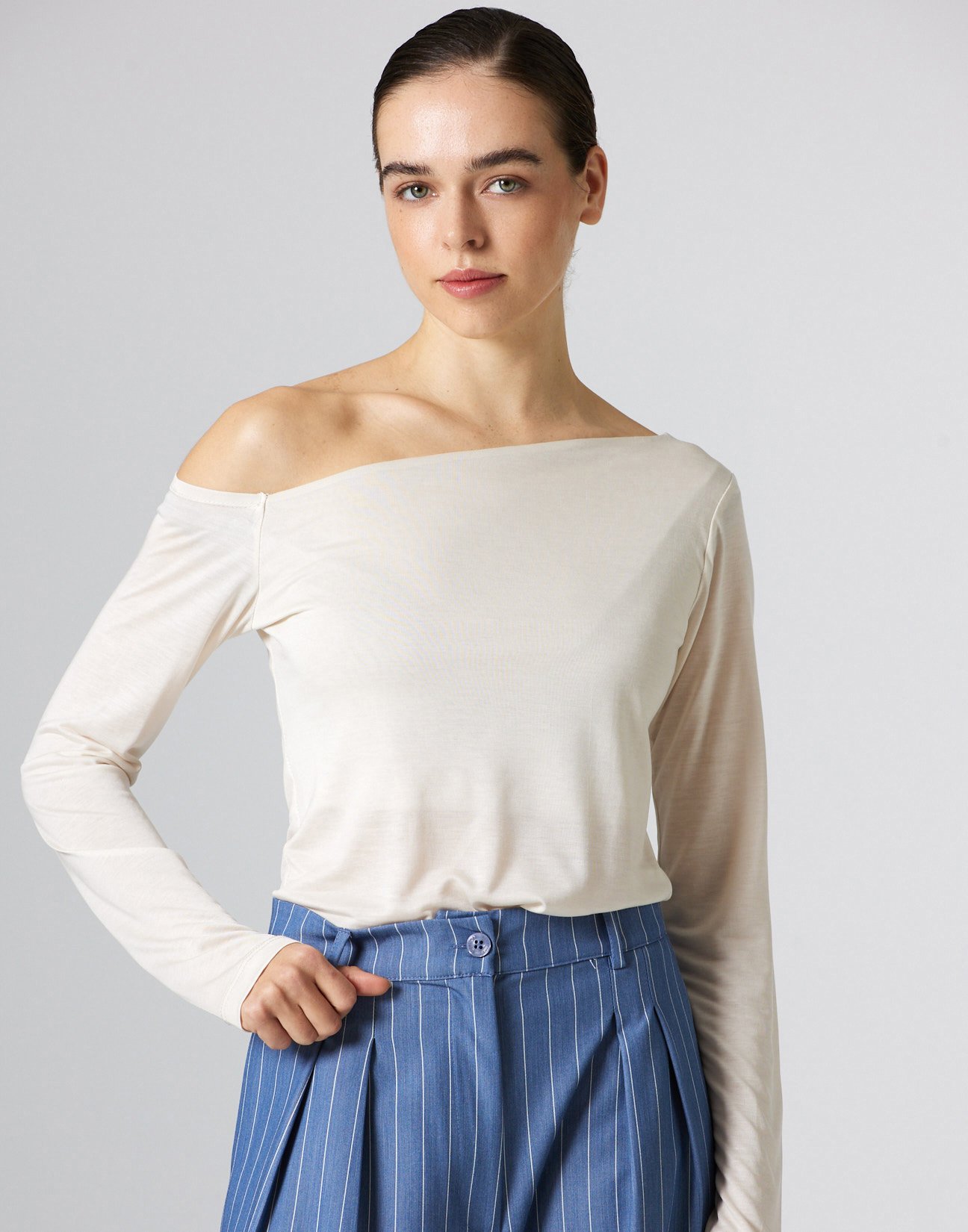 Top with asymmetric neckline