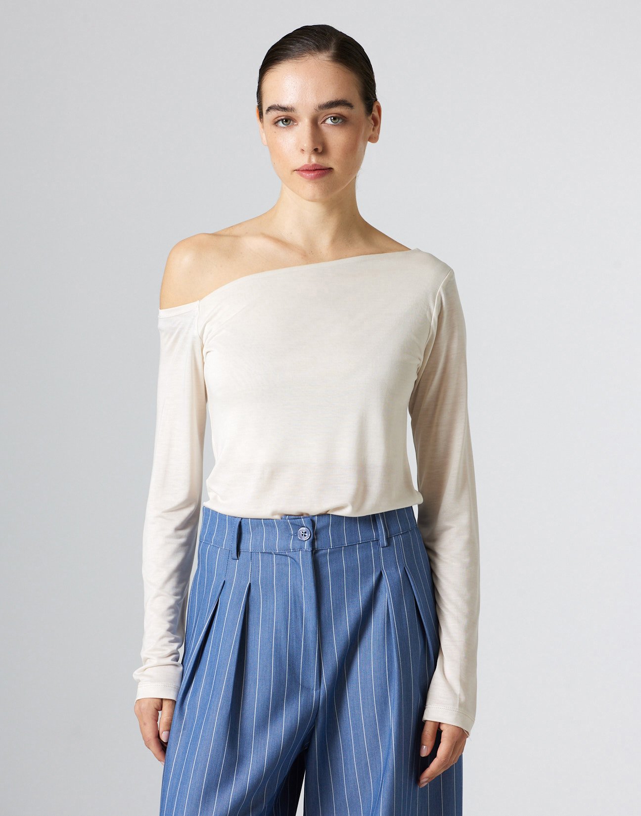 Top with asymmetric neckline