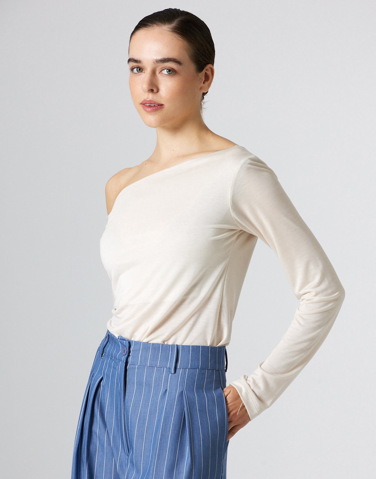 Top with asymmetric neckline