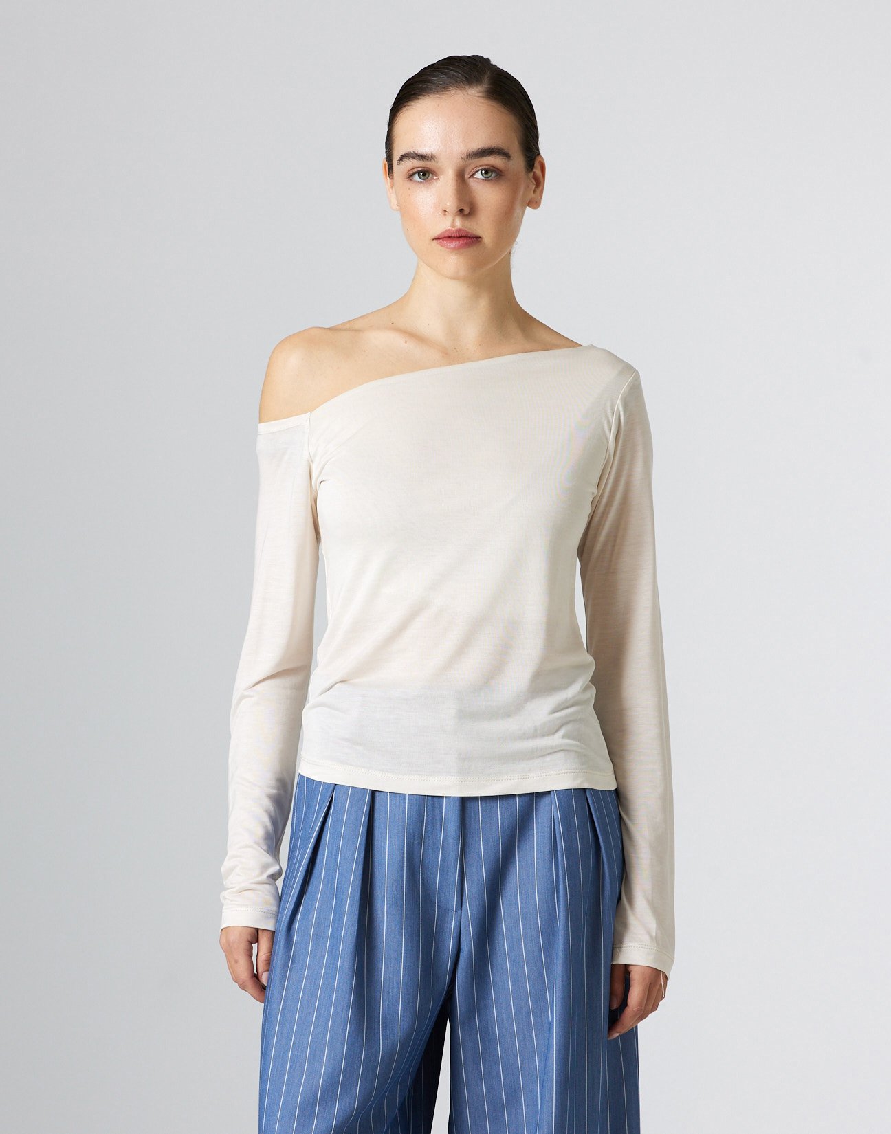 Top with asymmetric neckline