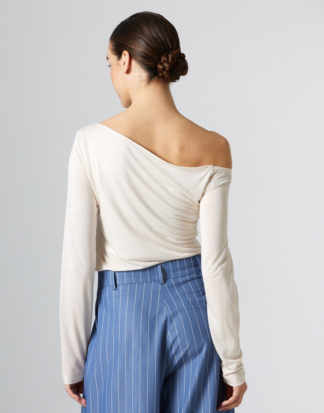 Top with asymmetric neckline