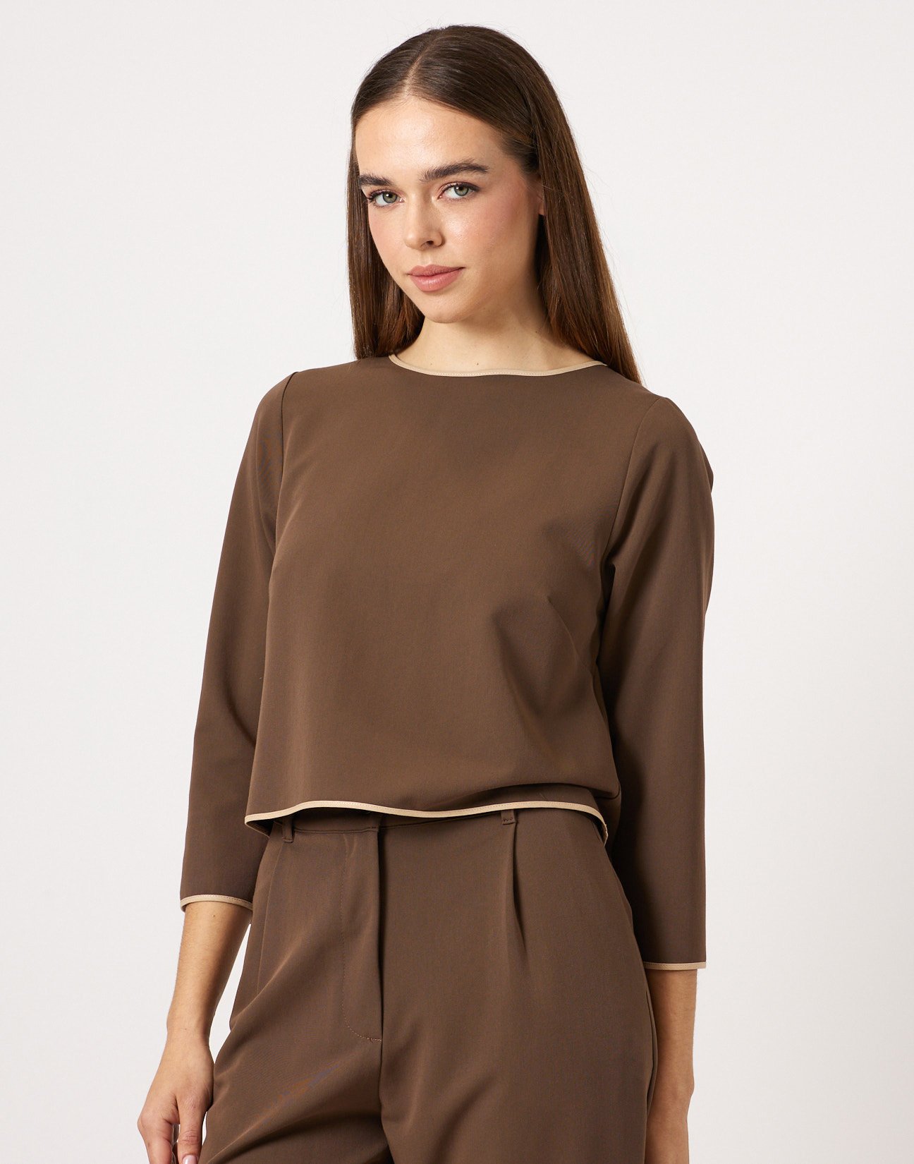 Blouse with piped seams