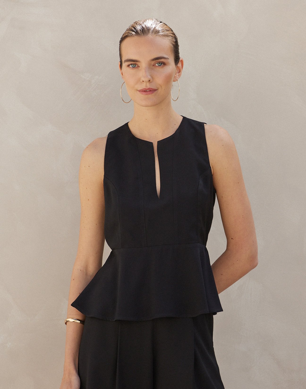 Sleeveless top with ruffles