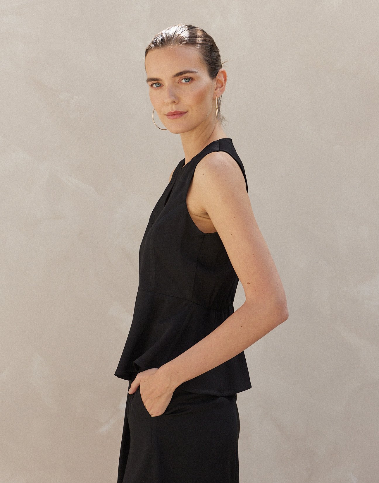 Sleeveless top with ruffles
