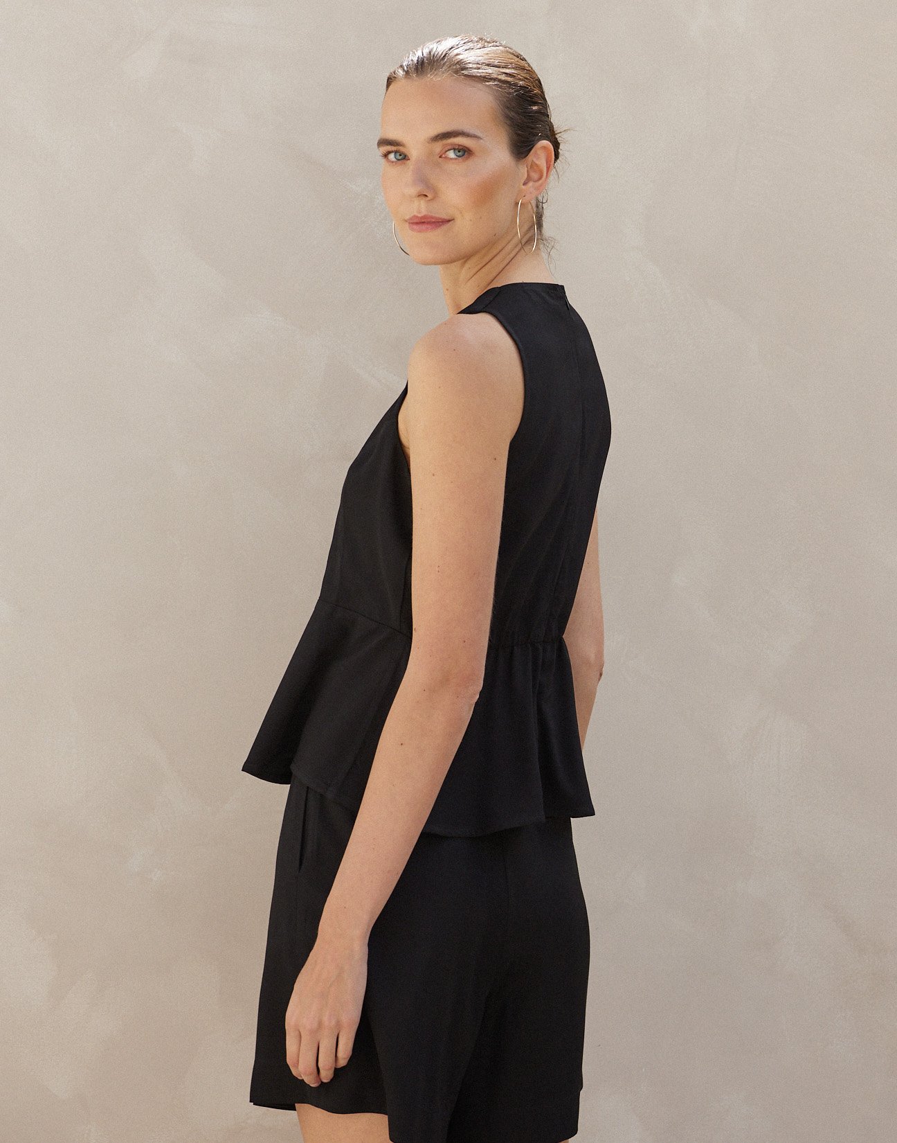 Sleeveless top with ruffles
