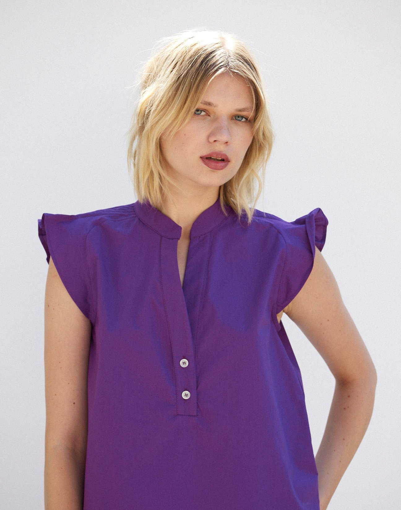 Blouse with pleats