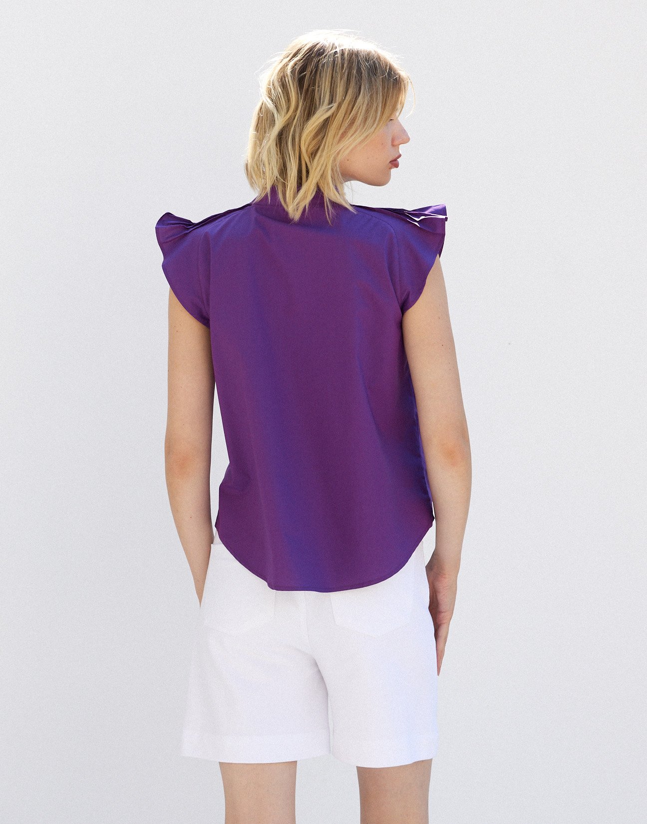Blouse with pleats