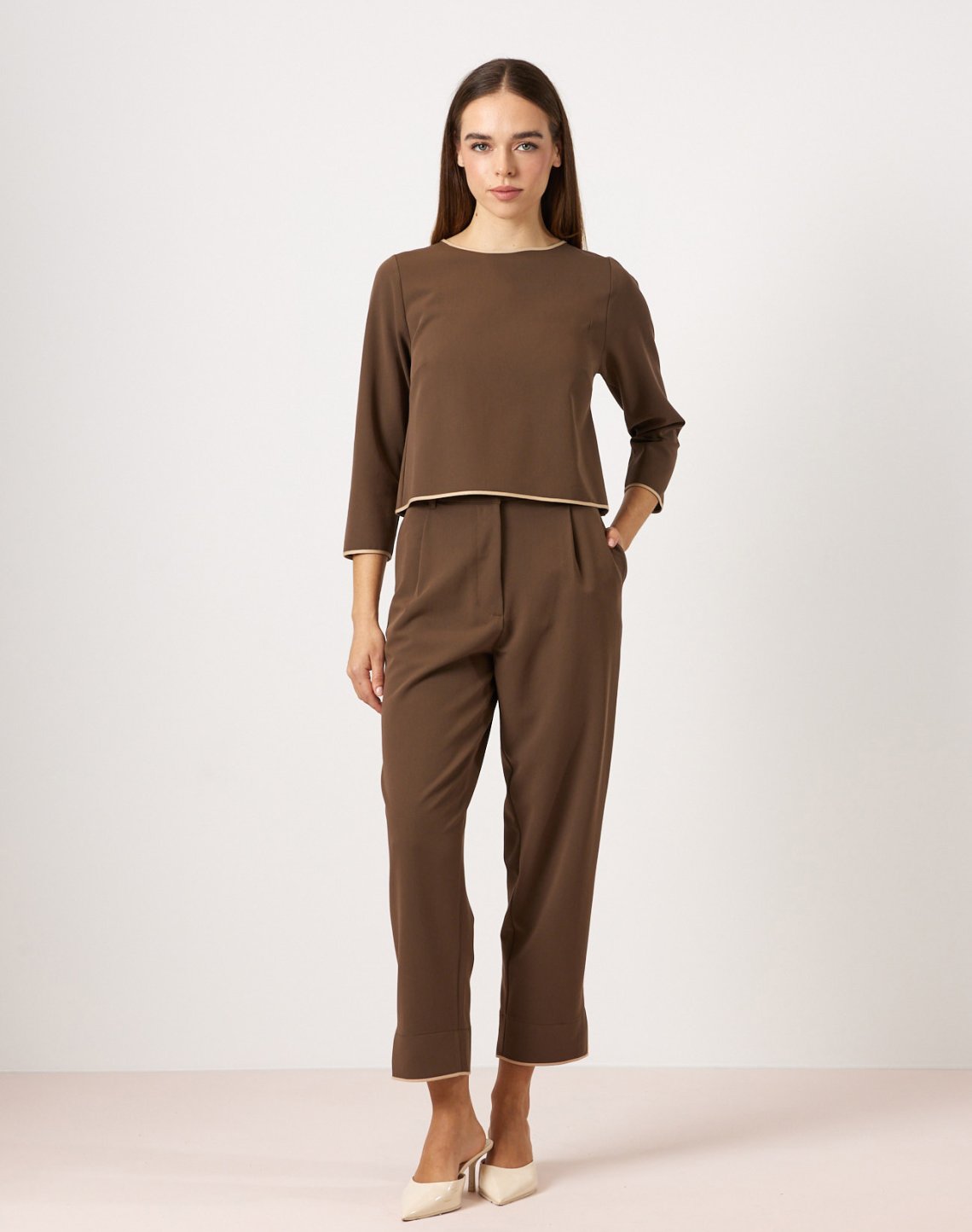 Trousers with piped seams