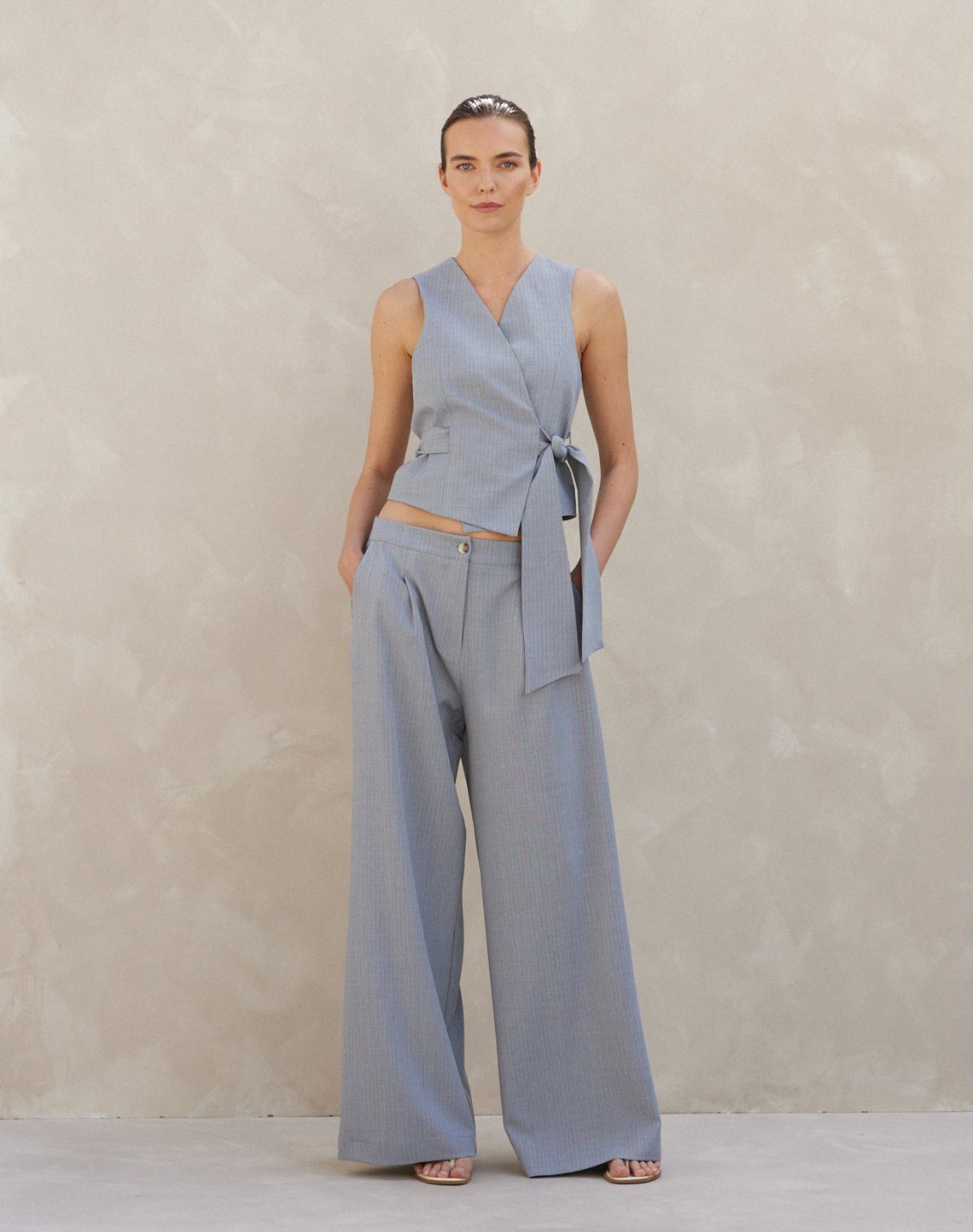 Pinstripe trousers with pleats