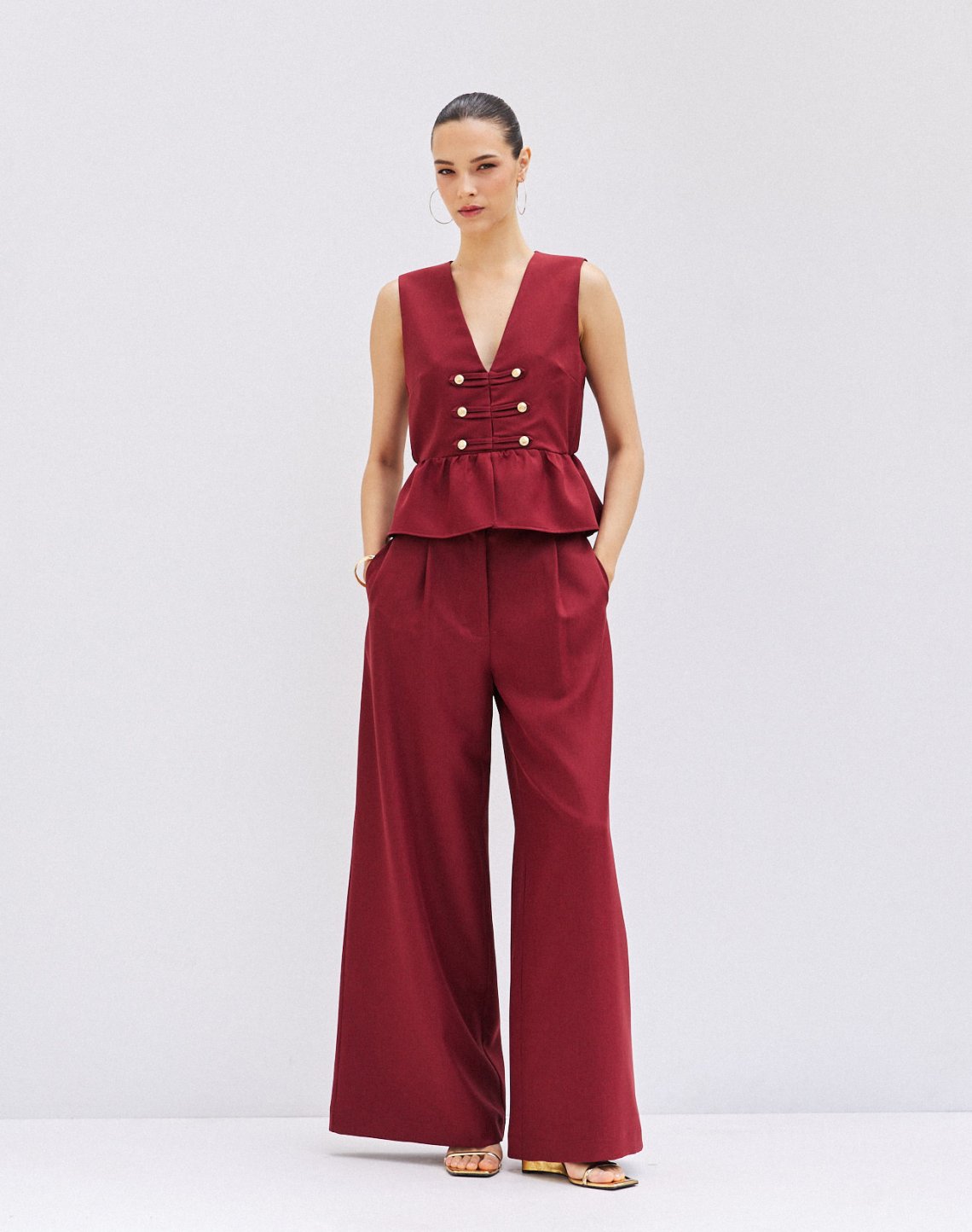 Trousers with buttons